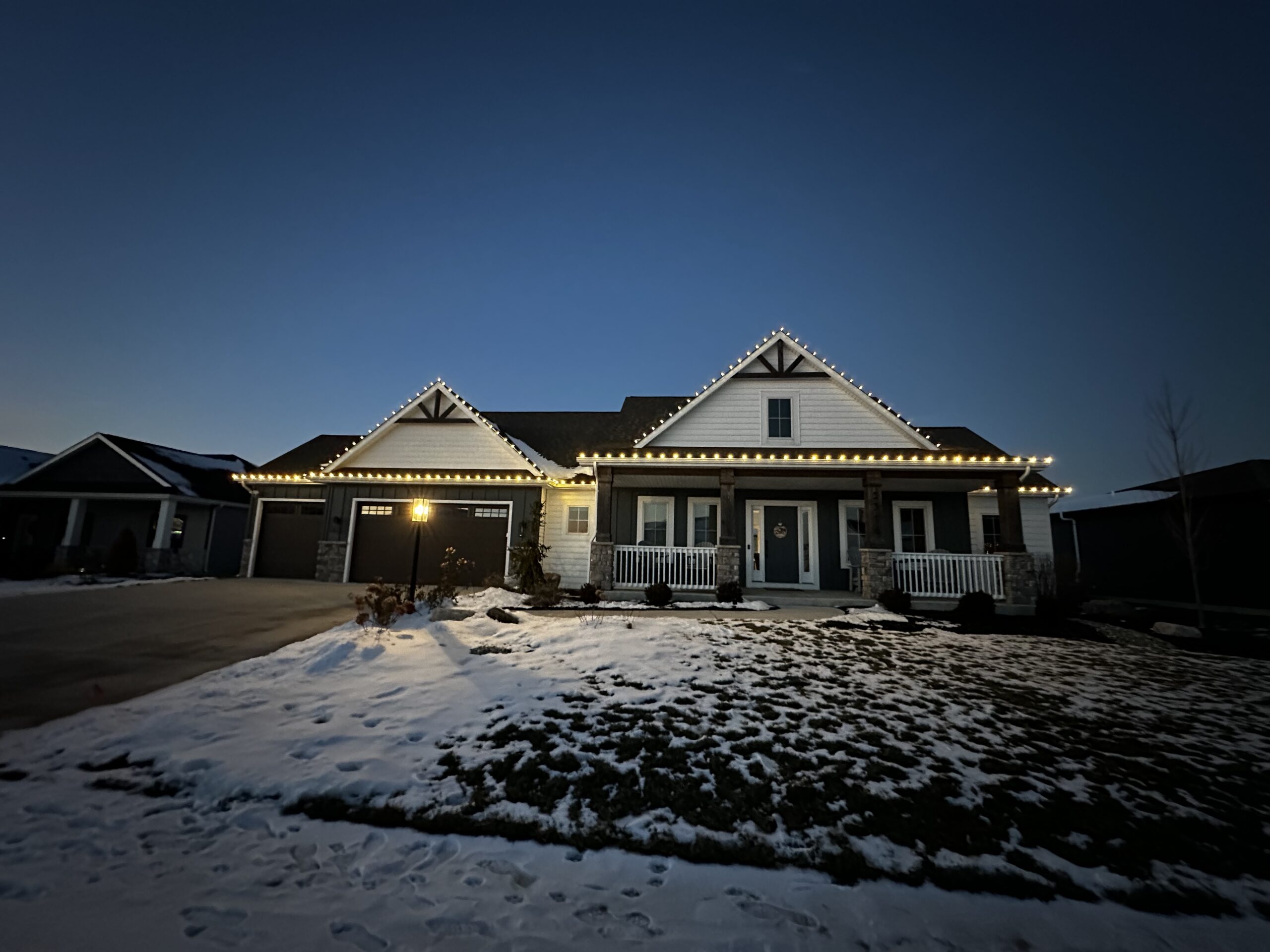 Professional Christmas light installation on a home exterior