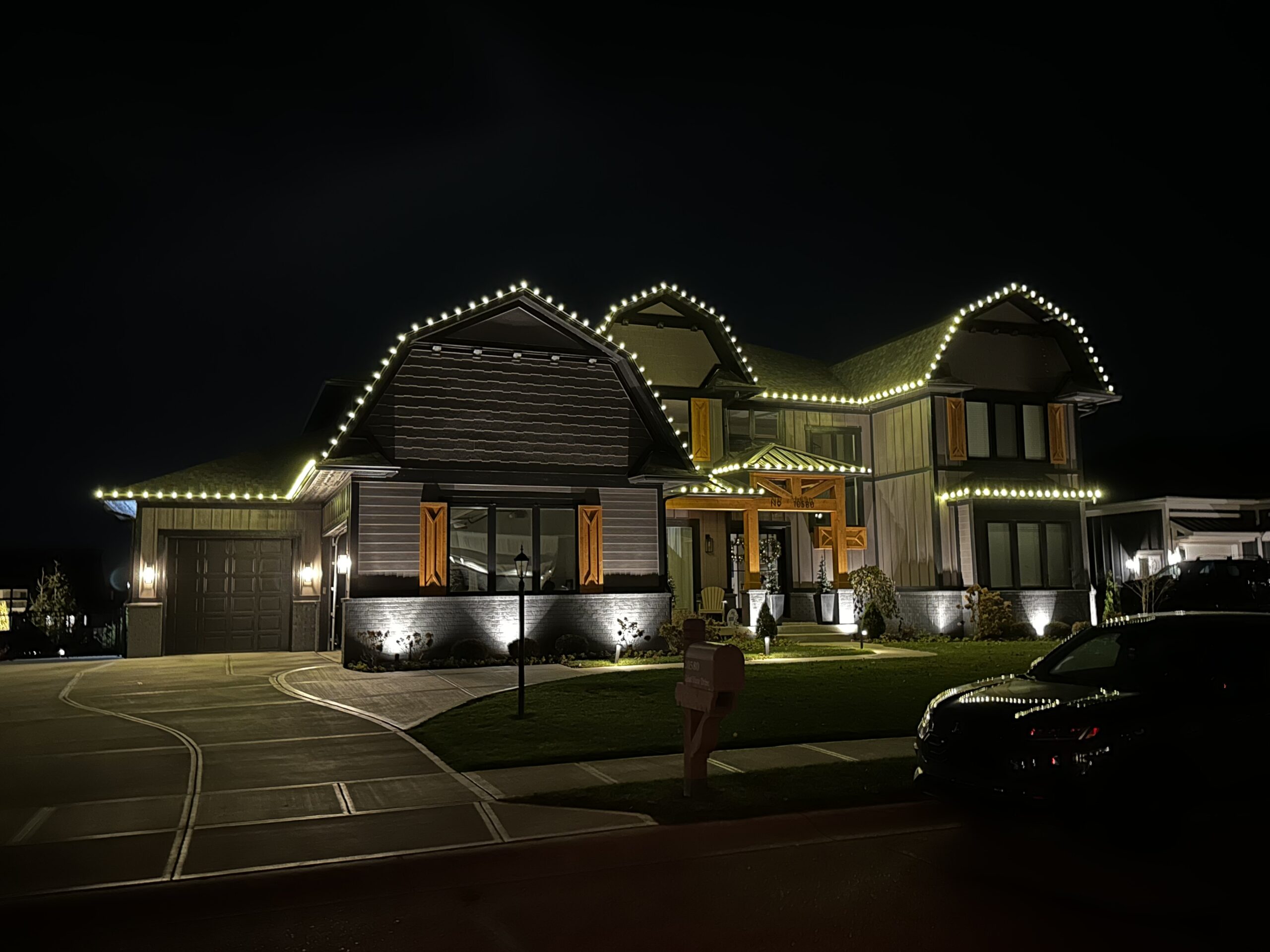 Christmas lights installed along a roofline in Fort Wayne